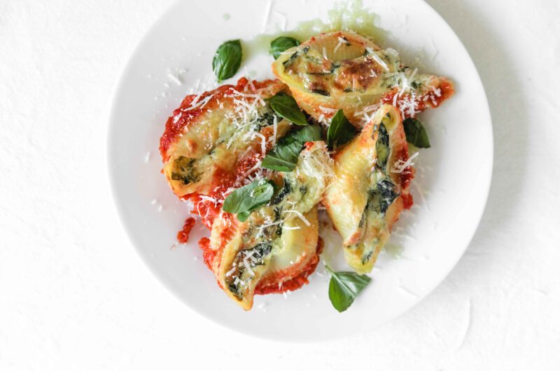 Pasta shells stuffed with spinach and ricotta in homemade tomato sauce
