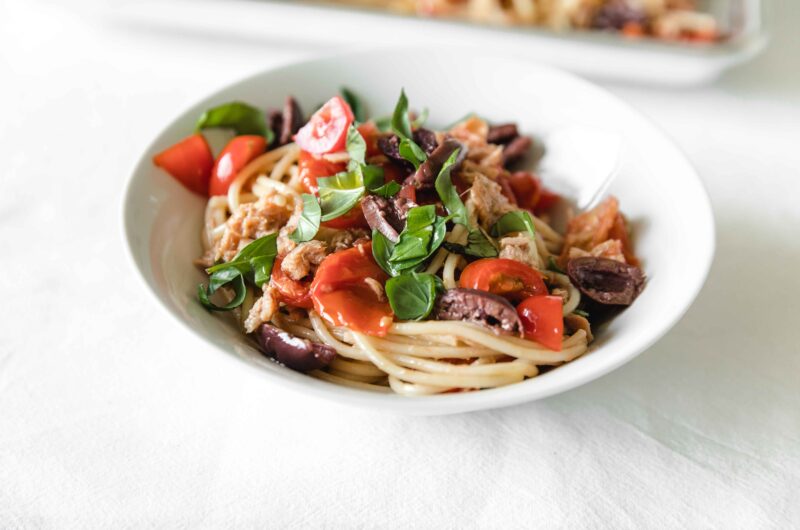 Pasta with tuna fish, tomatoes and black olives
