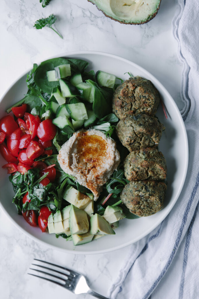 Buddha bowl with baked falafel, hummus and a whole lot of salad