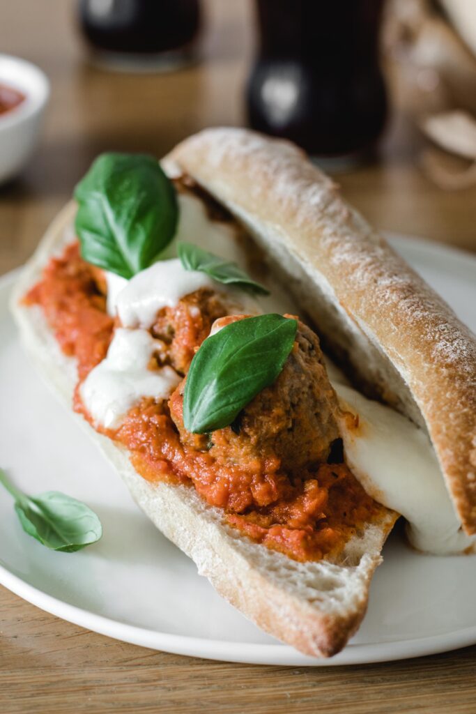Meatball sandwich with mozzarella and basil