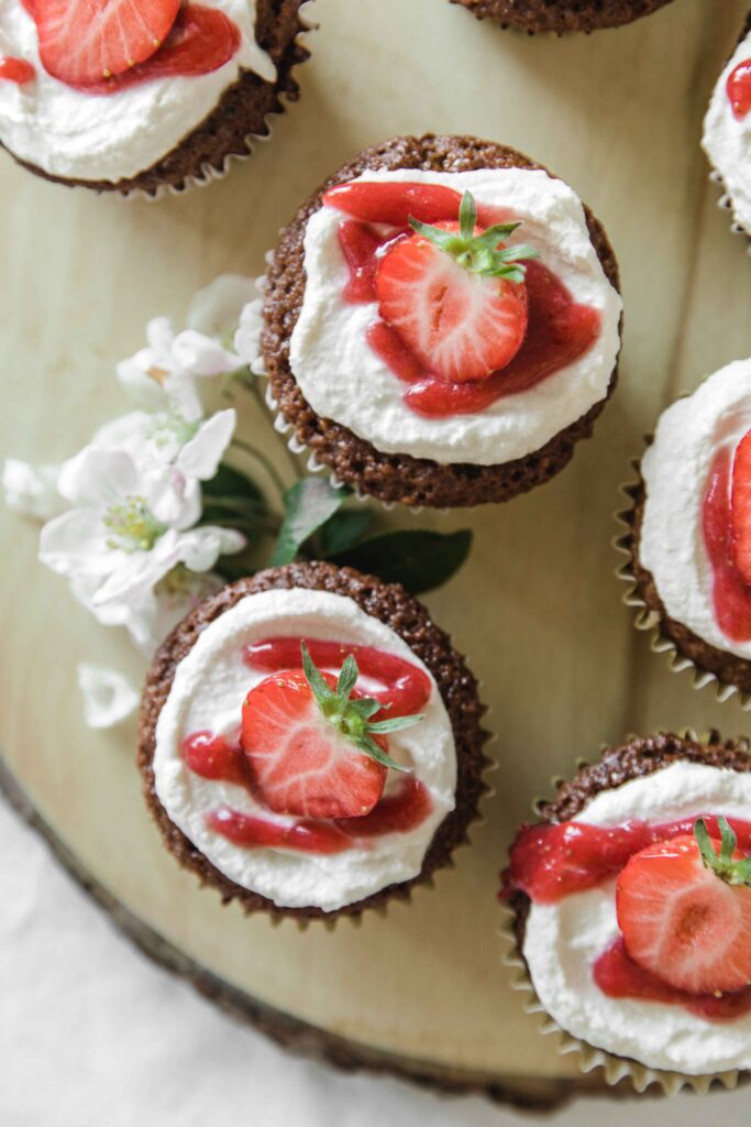 Vanilla cupcakes with strawberry filling and cream cheese frosting